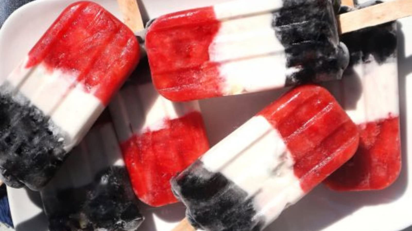 Festive red, white, and blue popsicles served as a patriotic frozen treat.
