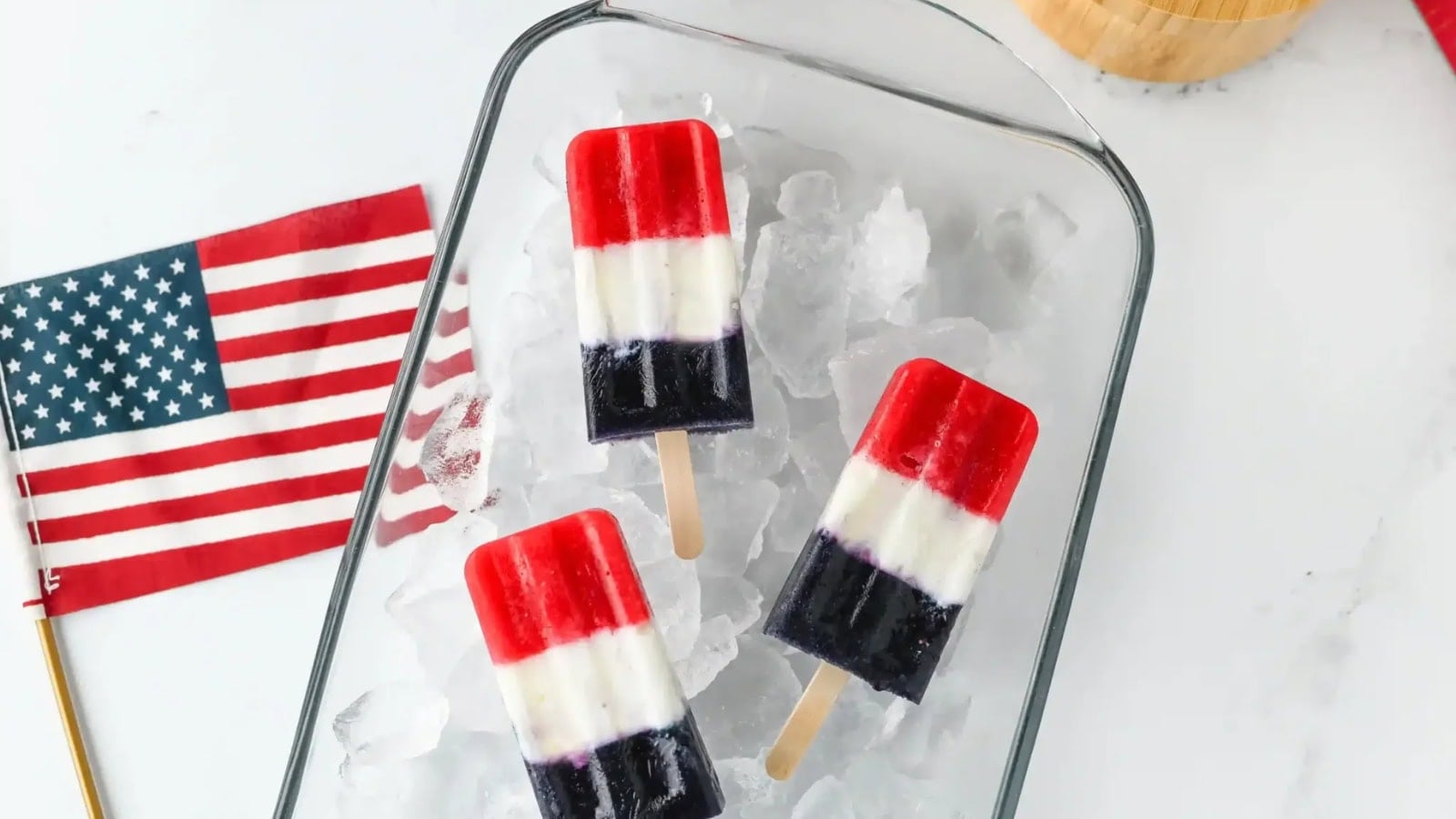 Patriotic popsicles layered with red, white, and blue fruit flavors.