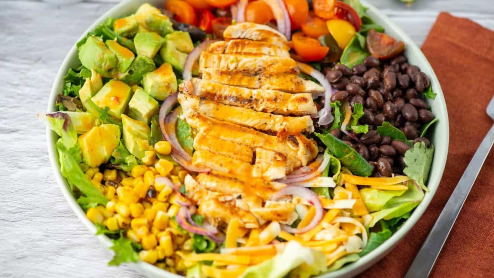Southwestern Cobb salad loaded with vegetables, protein, and toppings.