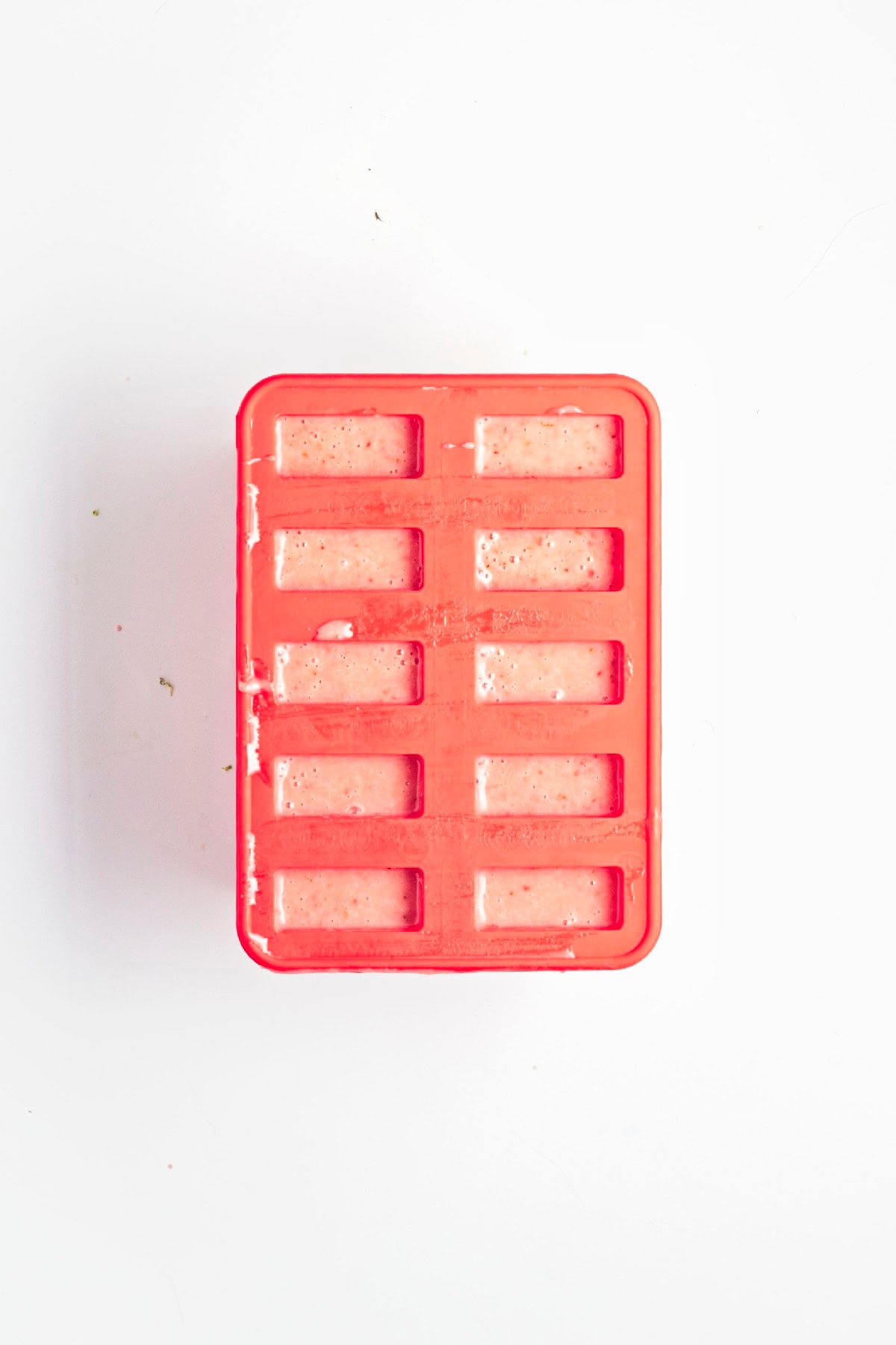 Strawberry popsicle mixture blended until smooth and creamy.