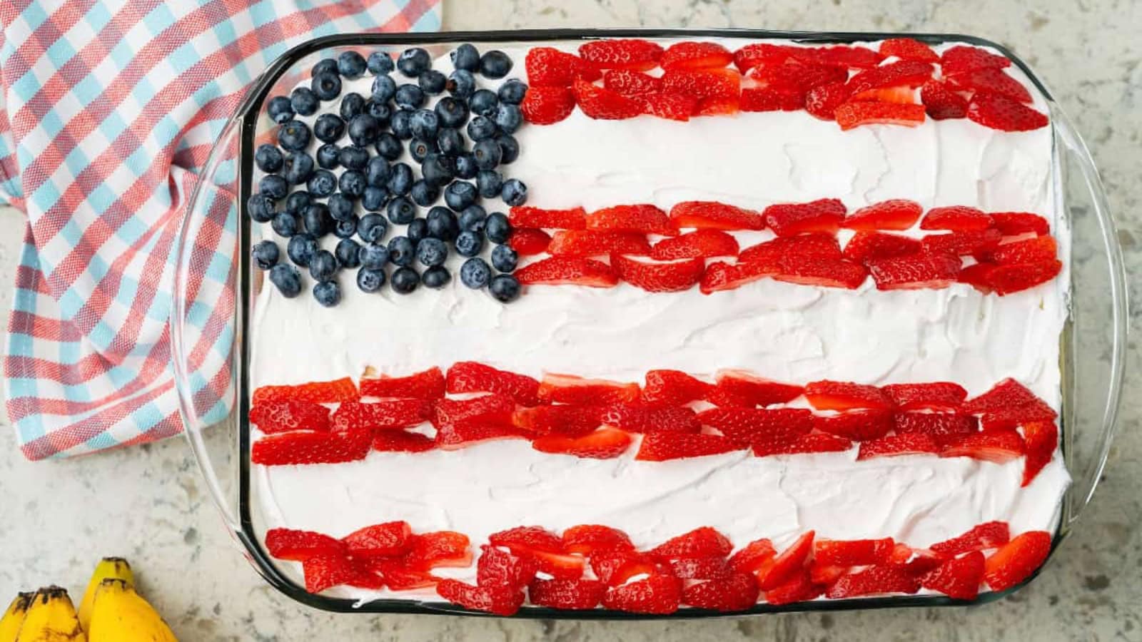 Banana pudding layered with mixed berries and creamy pudding.