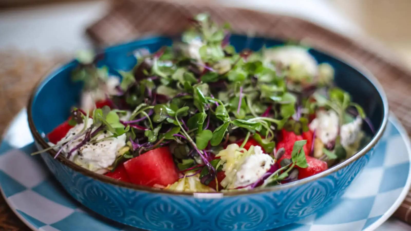Watermelon salad tossed with crunchy toppings and spicy sweet dressing.