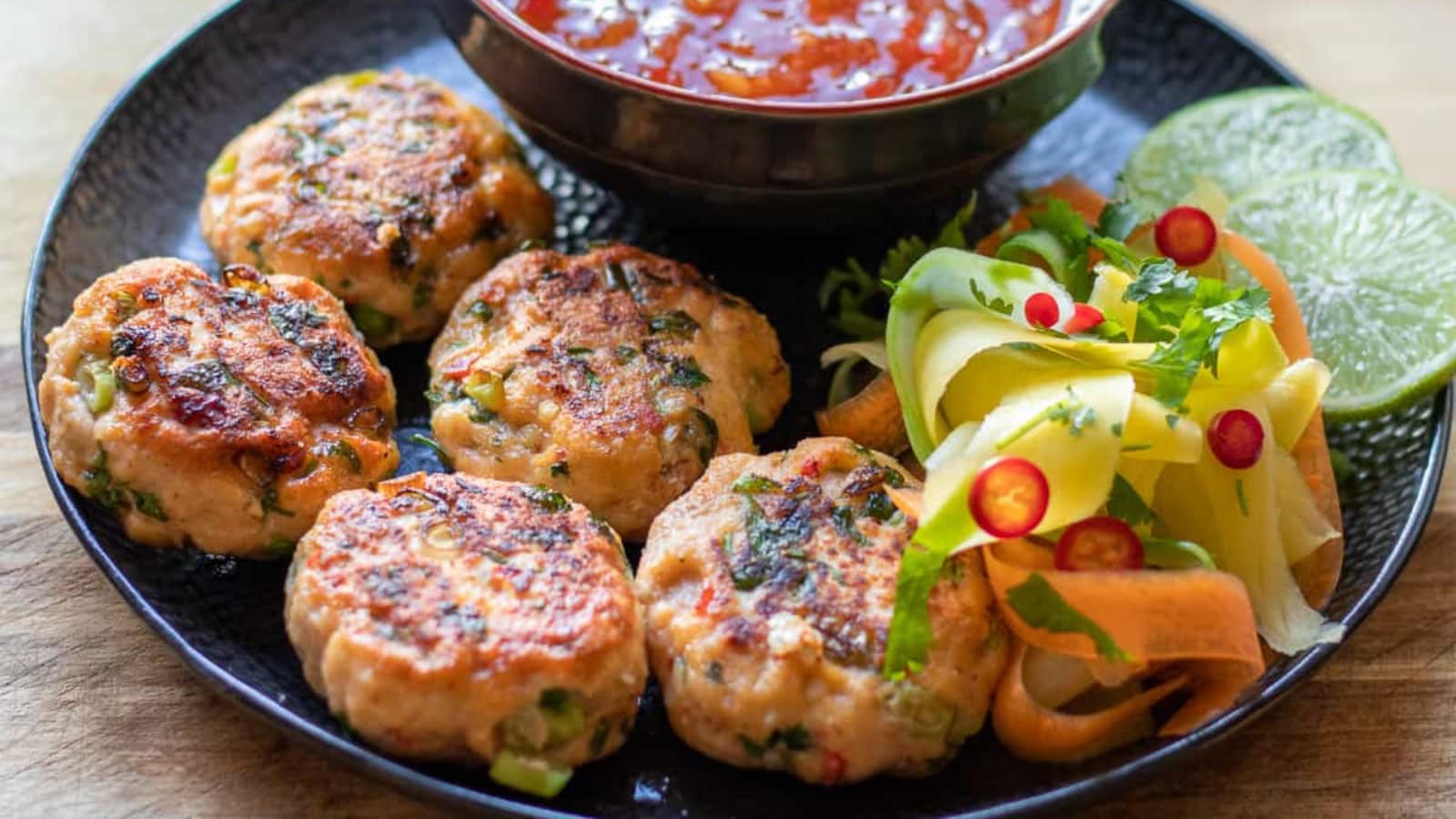 Thai fish cakes served with a flavorful dipping sauce.
