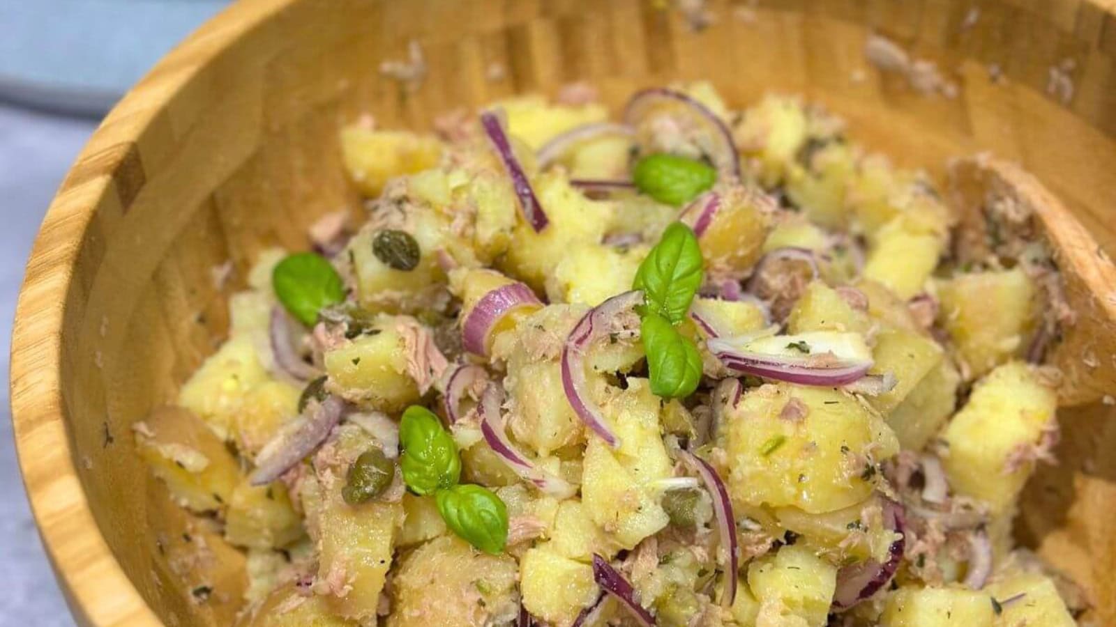 Potato salad mixed with tuna and creamy dressing.