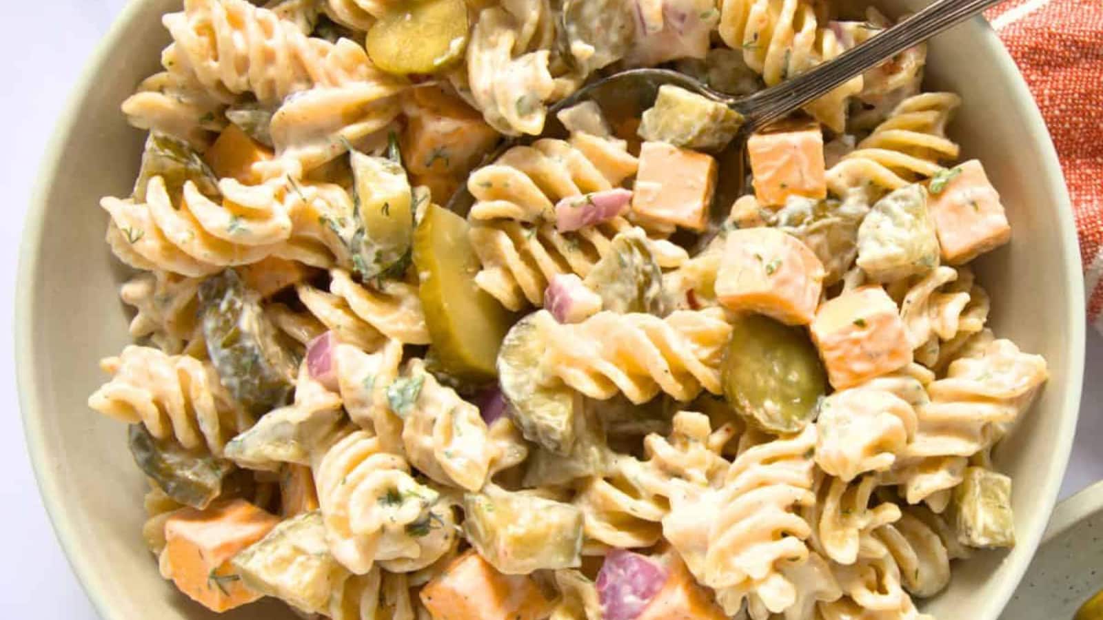 Vegetarian pasta salad tossed with dill pickles and fresh herbs.