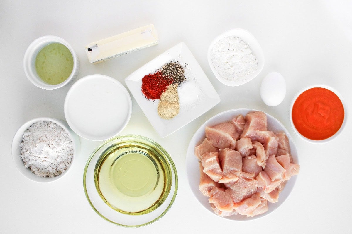 Boneless buffalo wings ingredients including chicken breast, flour, cornstarch, egg, buffalo sauce, oil, butter, and seasonings.