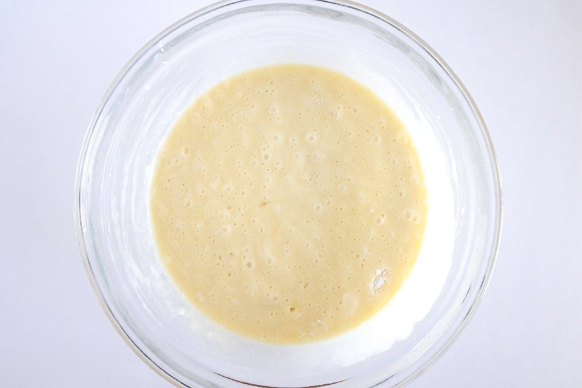 Cake batter mixed until smooth in a glass bowl.