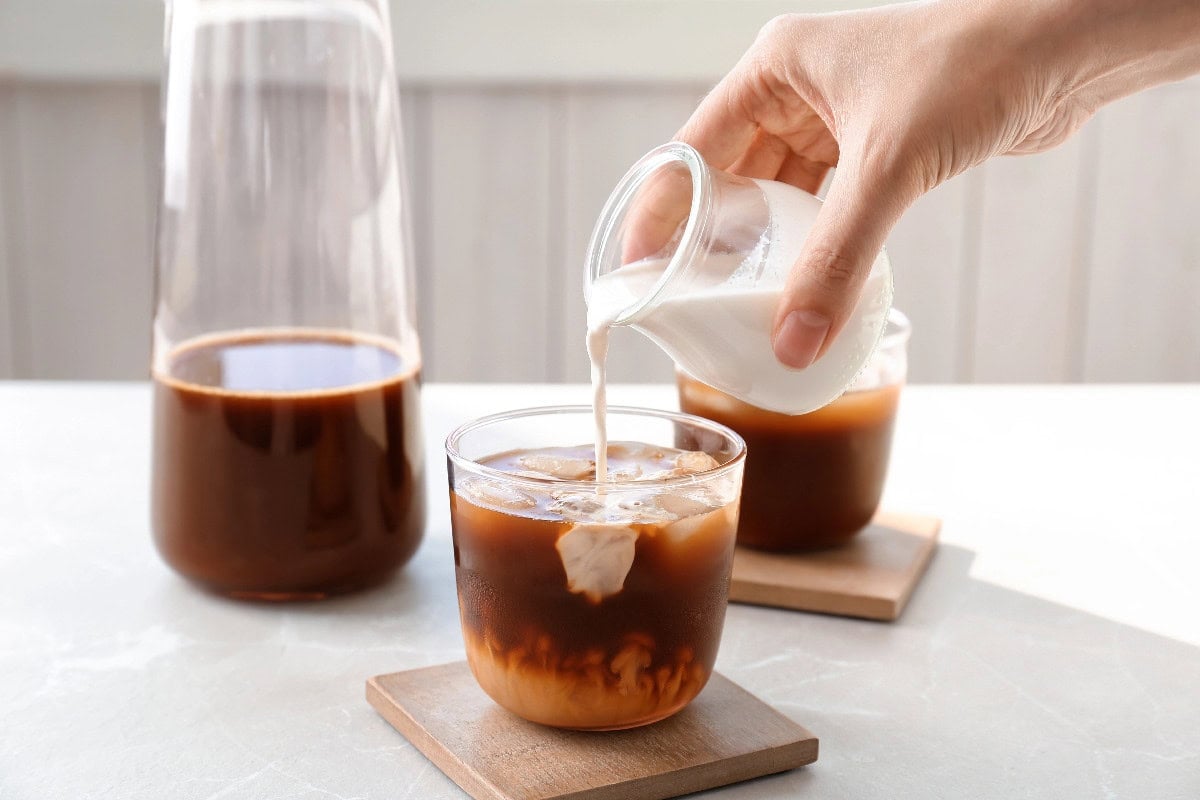 Homemade cold brew coffee with milk poured over ice.