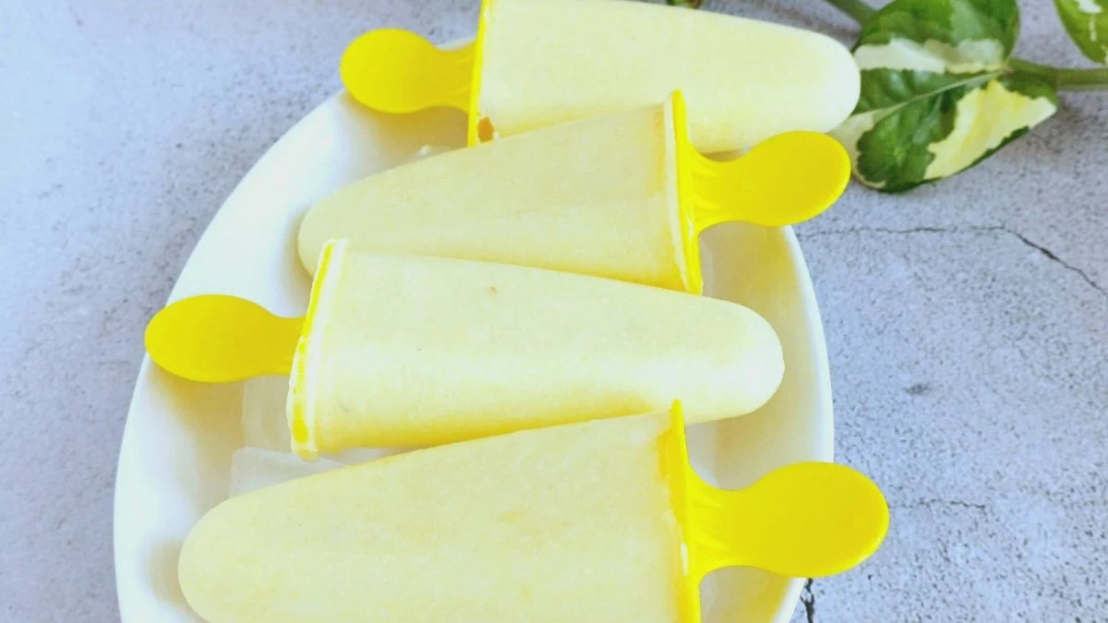 Tropical pineapple coconut popsicles frozen until perfectly refreshing.