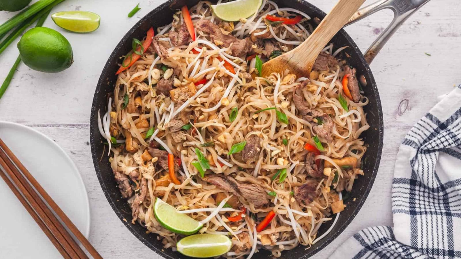 Rice noodles stir-fried with beef, vegetables, and tangy sauce.