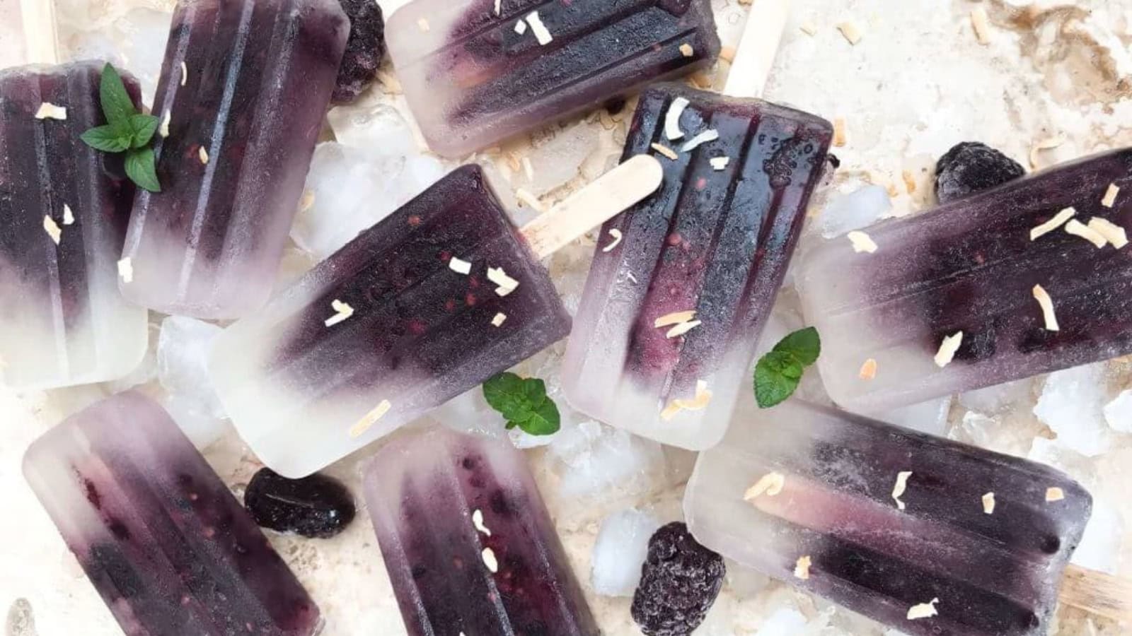 Creamy blackberry coconut popsicles with a refreshing fruity flavor.