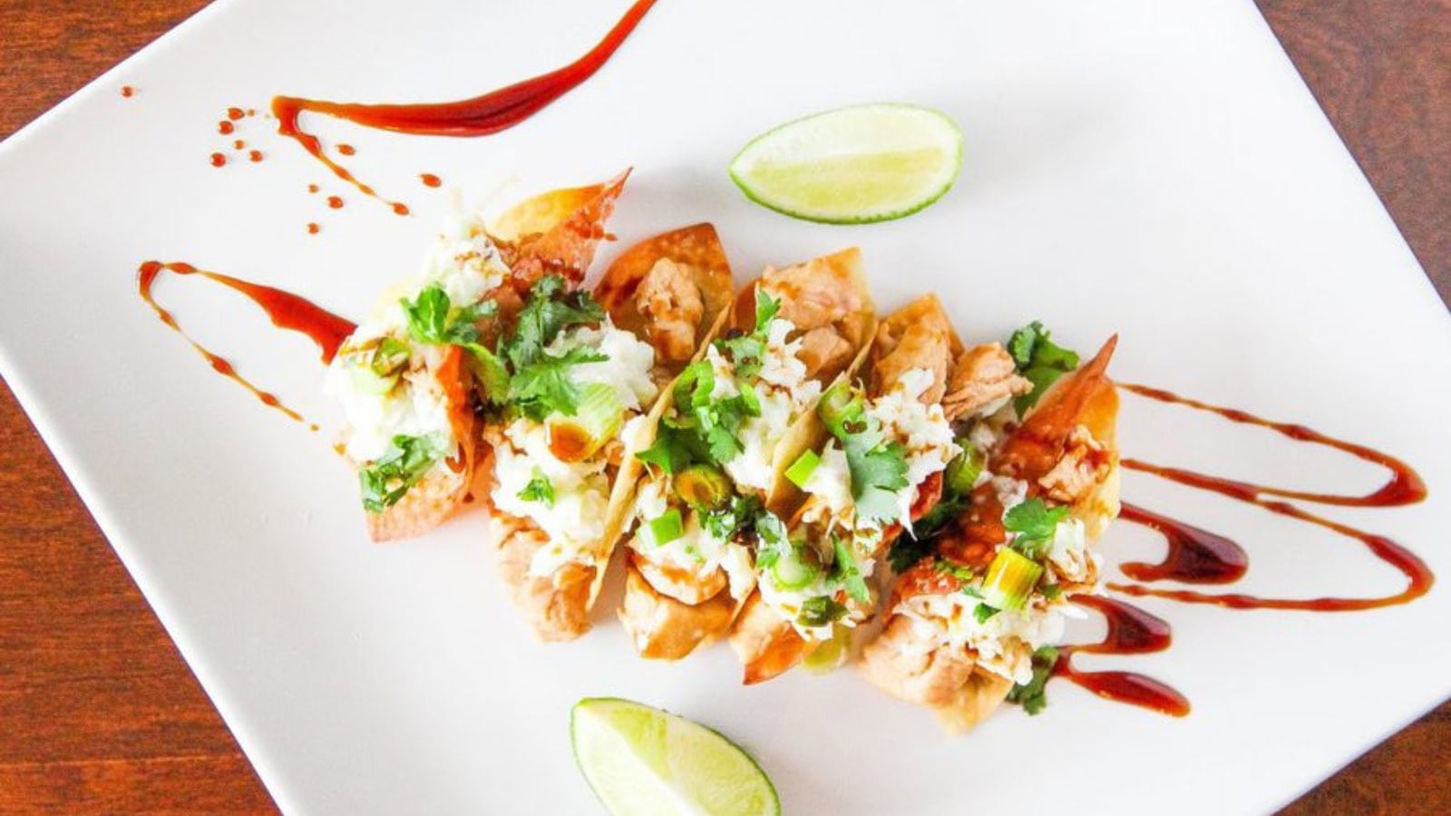 Crispy wonton shells filled with seasoned meat and fresh toppings.