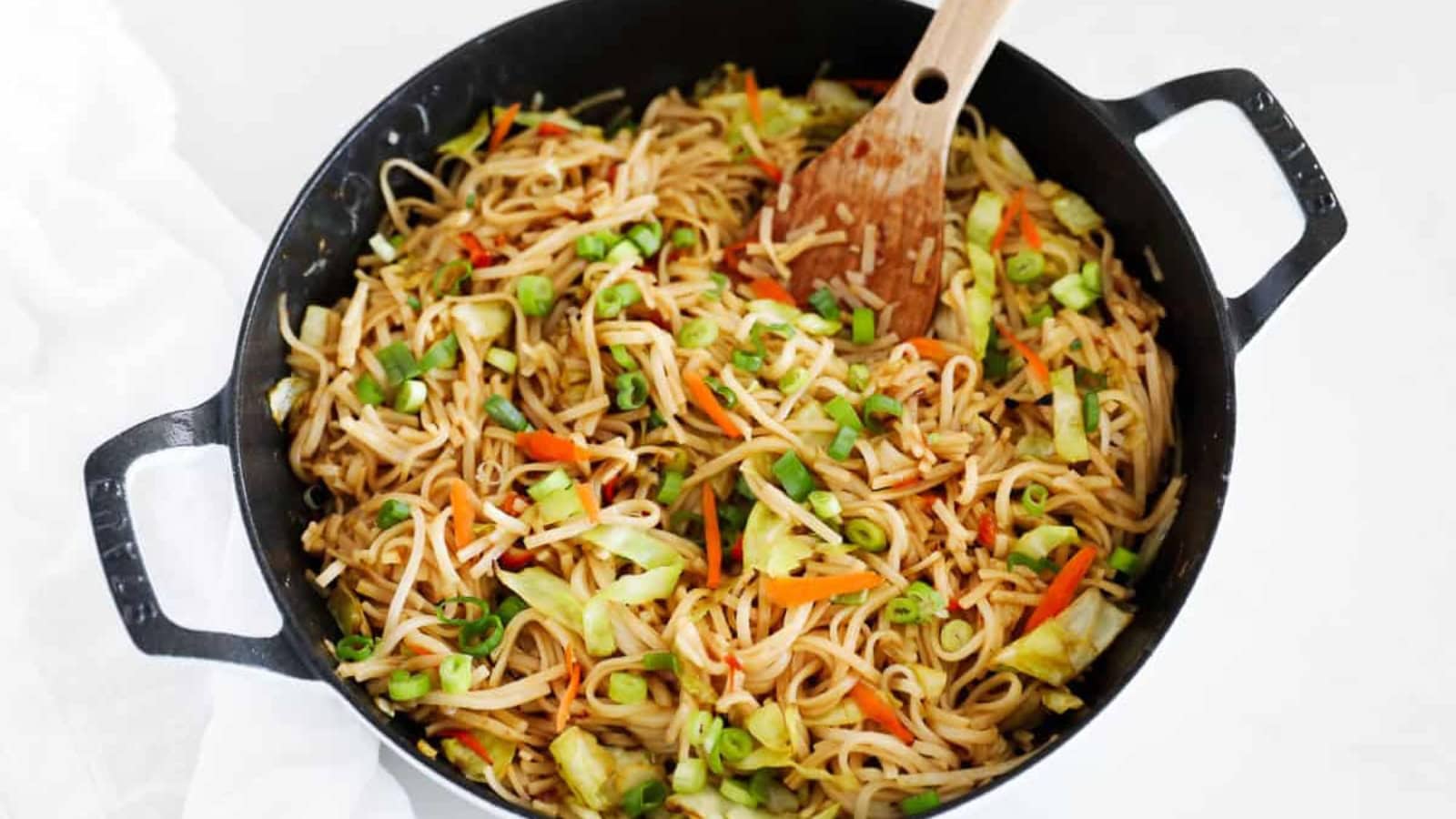 Stir-fried noodles tossed with vegetables in a savory sauce.