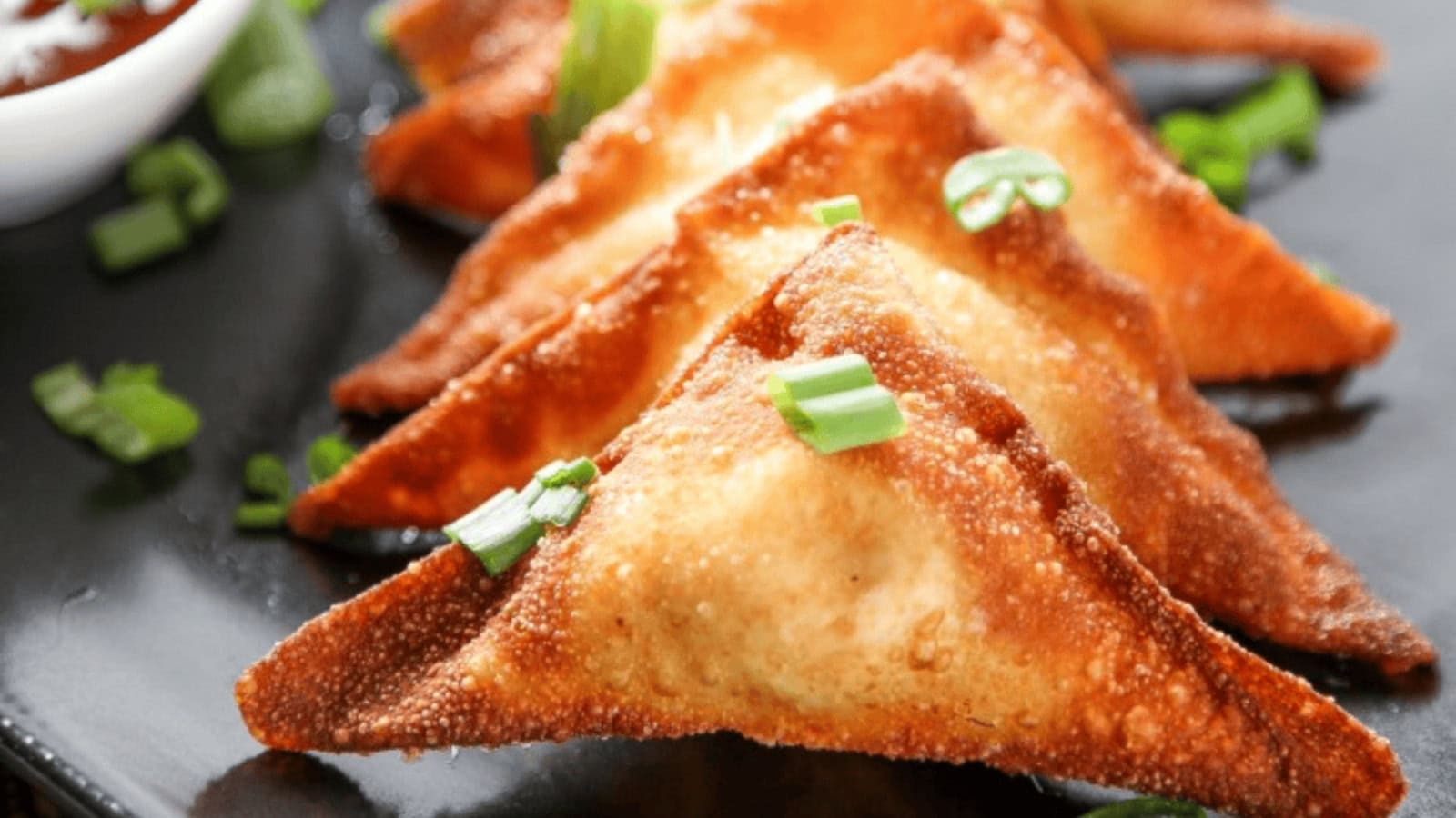 Crispy wontons filled with creamy seasoned cream cheese.