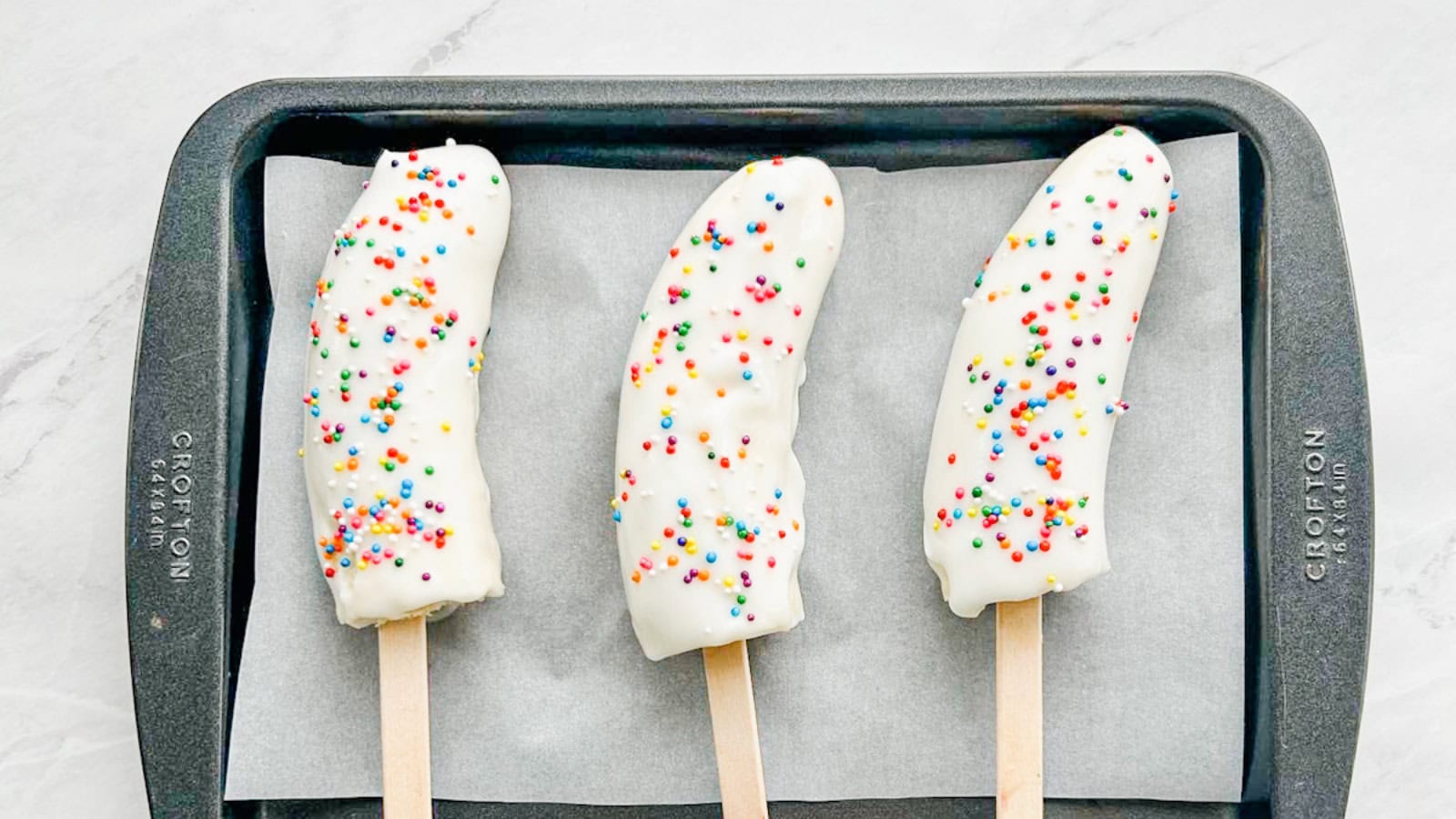 Creamy banana yogurt popsicles frozen until perfectly refreshing.