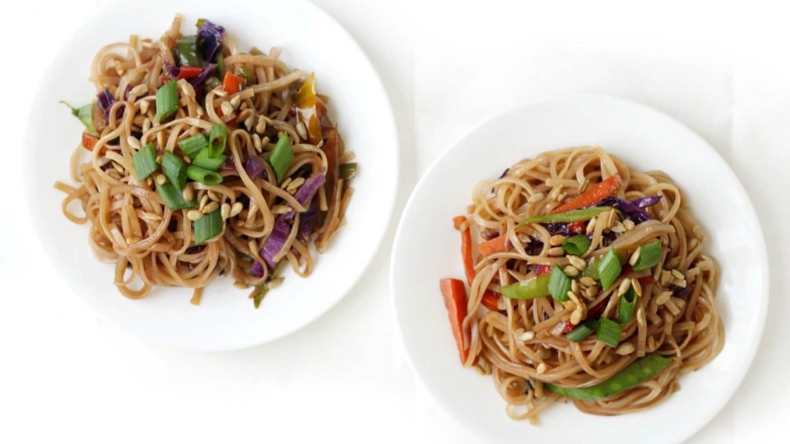 Vegan Pad Thai with rice noodles, vegetables, and crunchy peanuts.