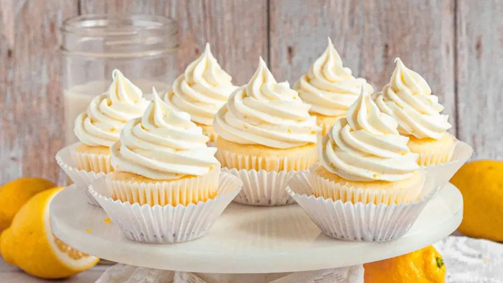 Light gluten-free lemon cupcakes topped with tangy lemon frosting.