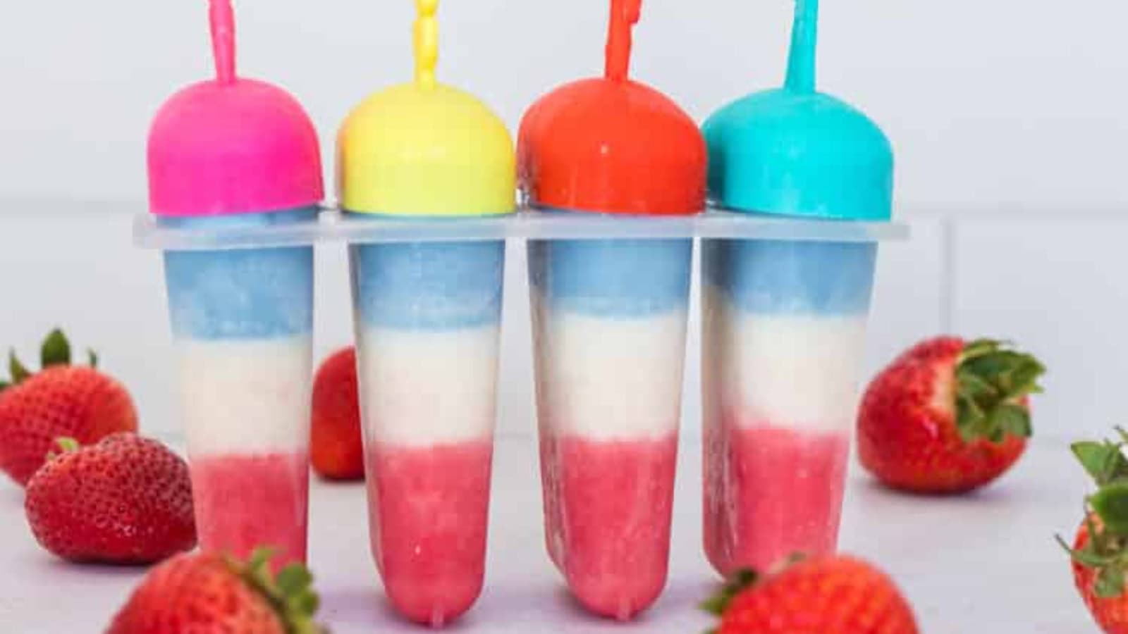 Patriotic layered popsicles made with colorful fresh fruit.
