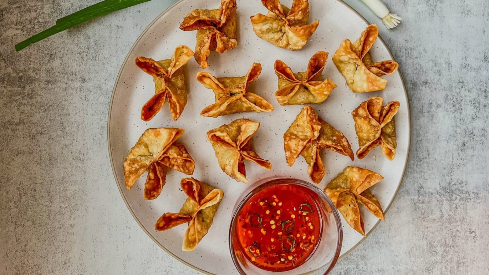 Crispy crab rangoons filled with a creamy crab and cheese mixture.
