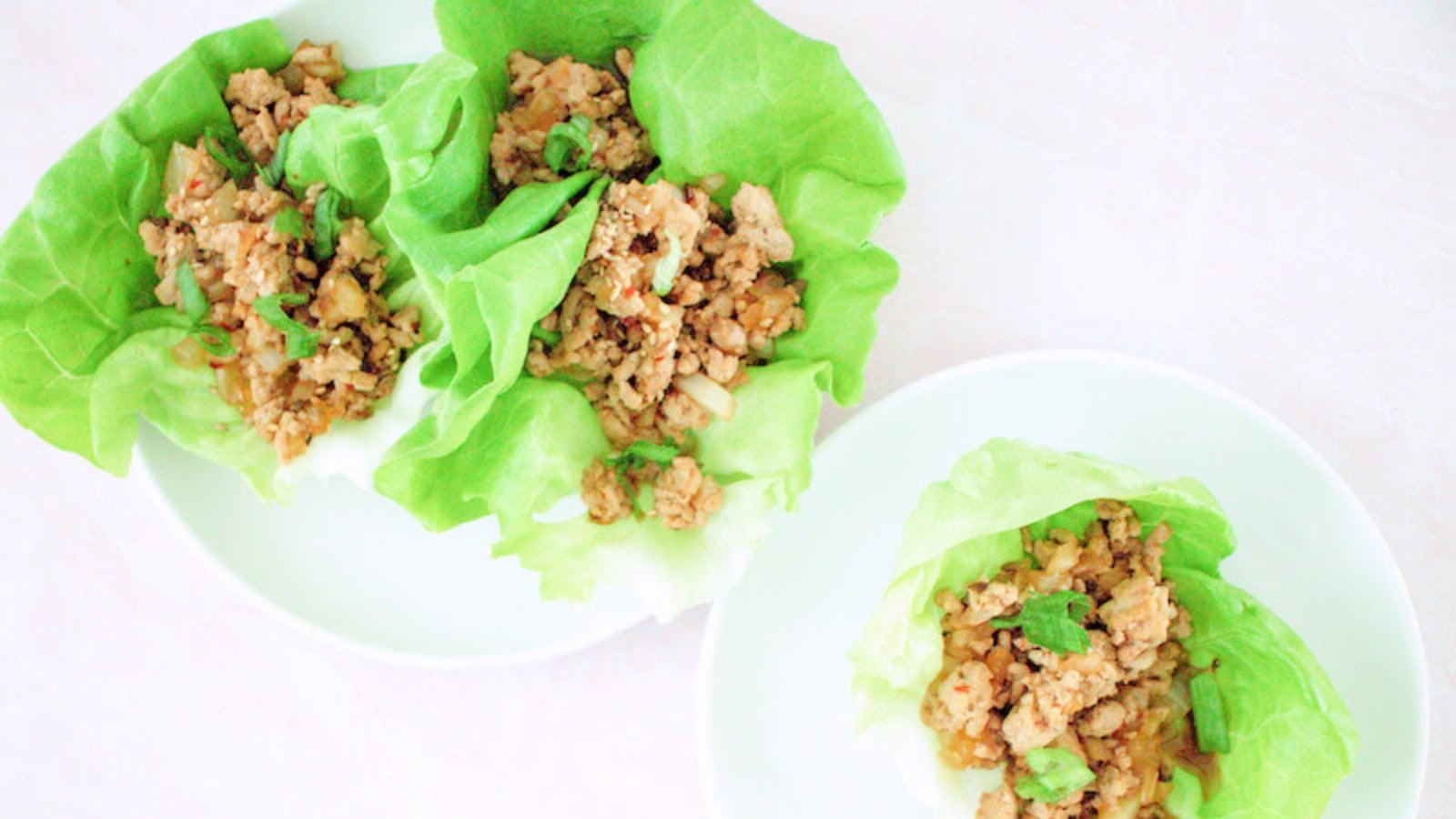Chicken lettuce wraps served with crisp lettuce leaves and savory filling.