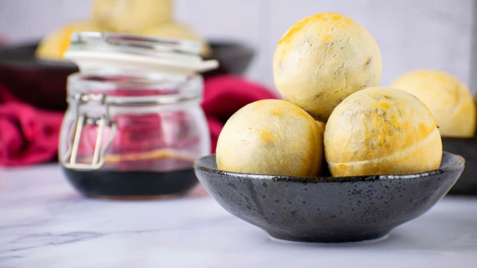Mini steamed pork buns with a fluffy dough and savory filling.