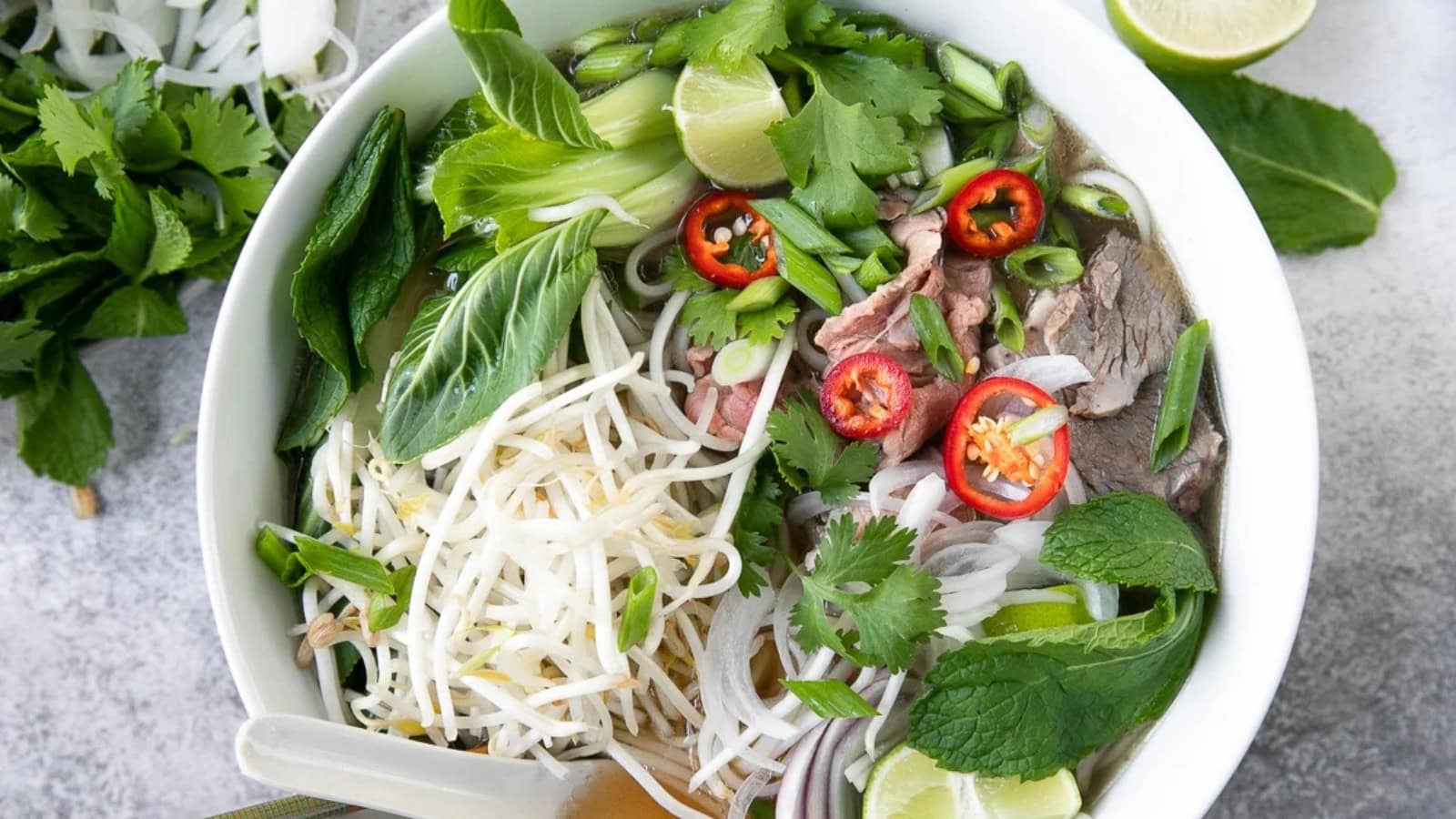 Traditional pho with rice noodles, beef, and fresh herbs.