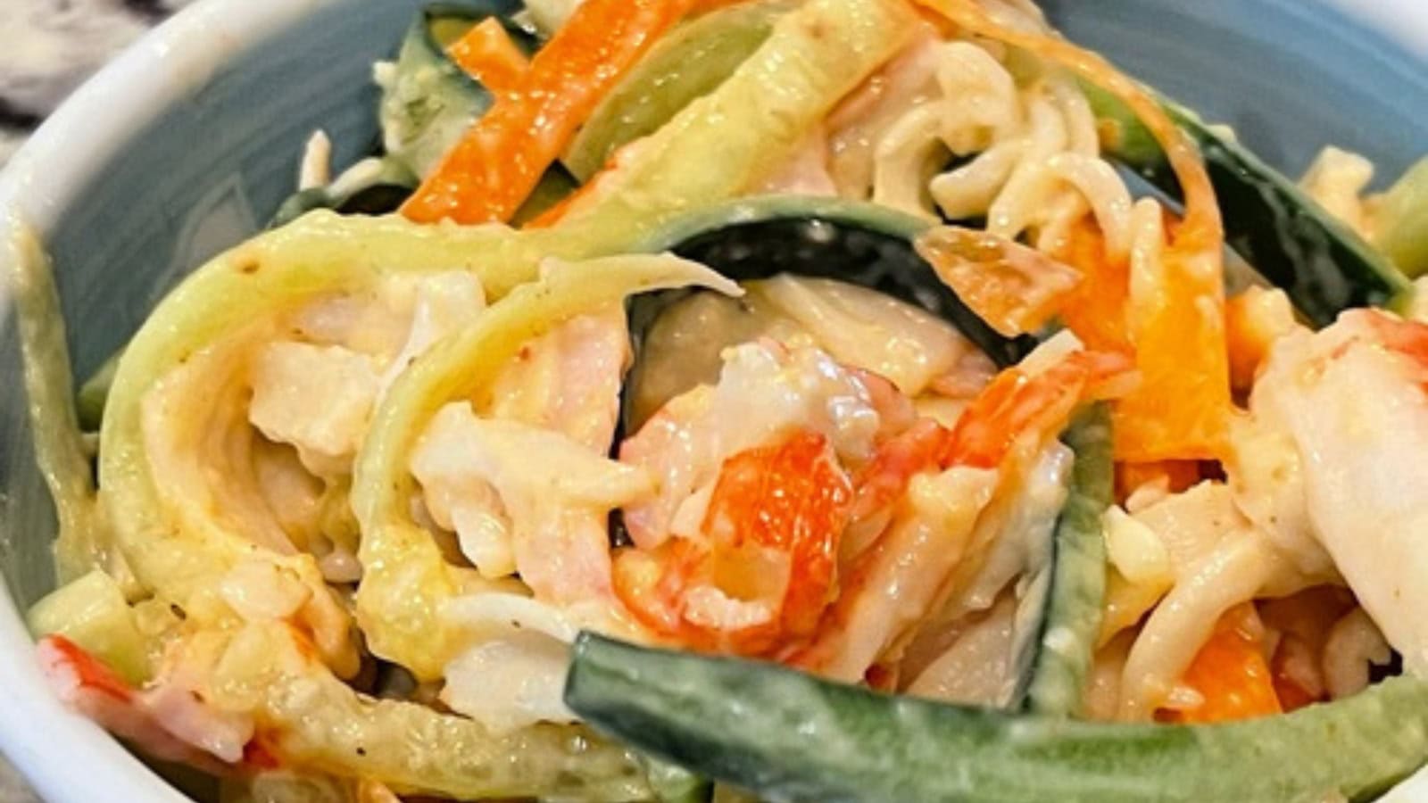 Japanese kani salad made with shredded crab, cucumber, and spicy dressing.
