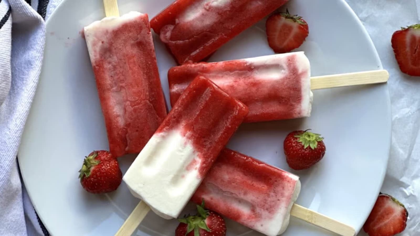 Creamy breakfast popsicles made with strawberries and yogurt.