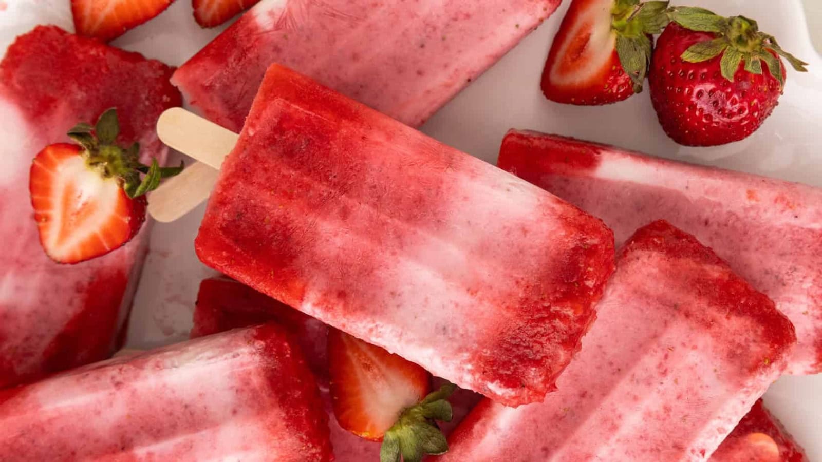 Creamy strawberry popsicles made with fresh strawberries.