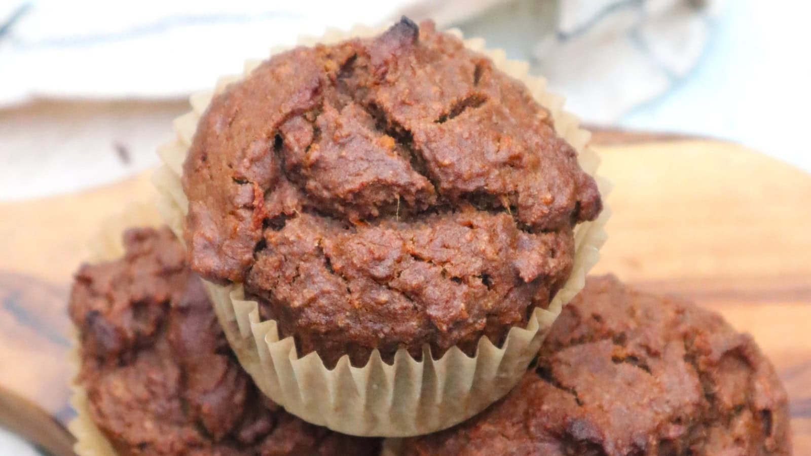 Moist sweet potato muffins flavored with teff, tahini, and orange.