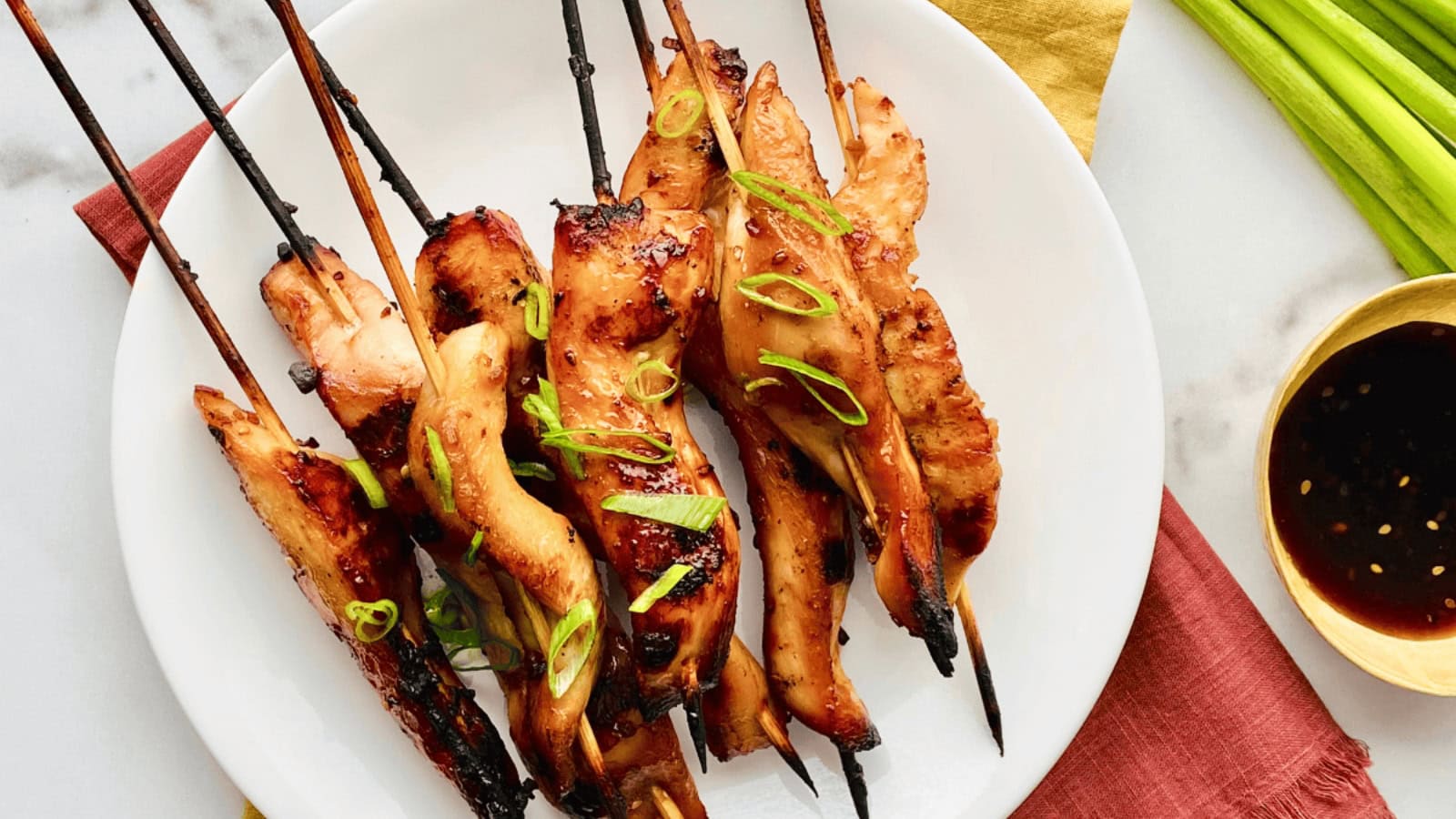 Grilled chicken skewers glazed with sweet teriyaki sauce.