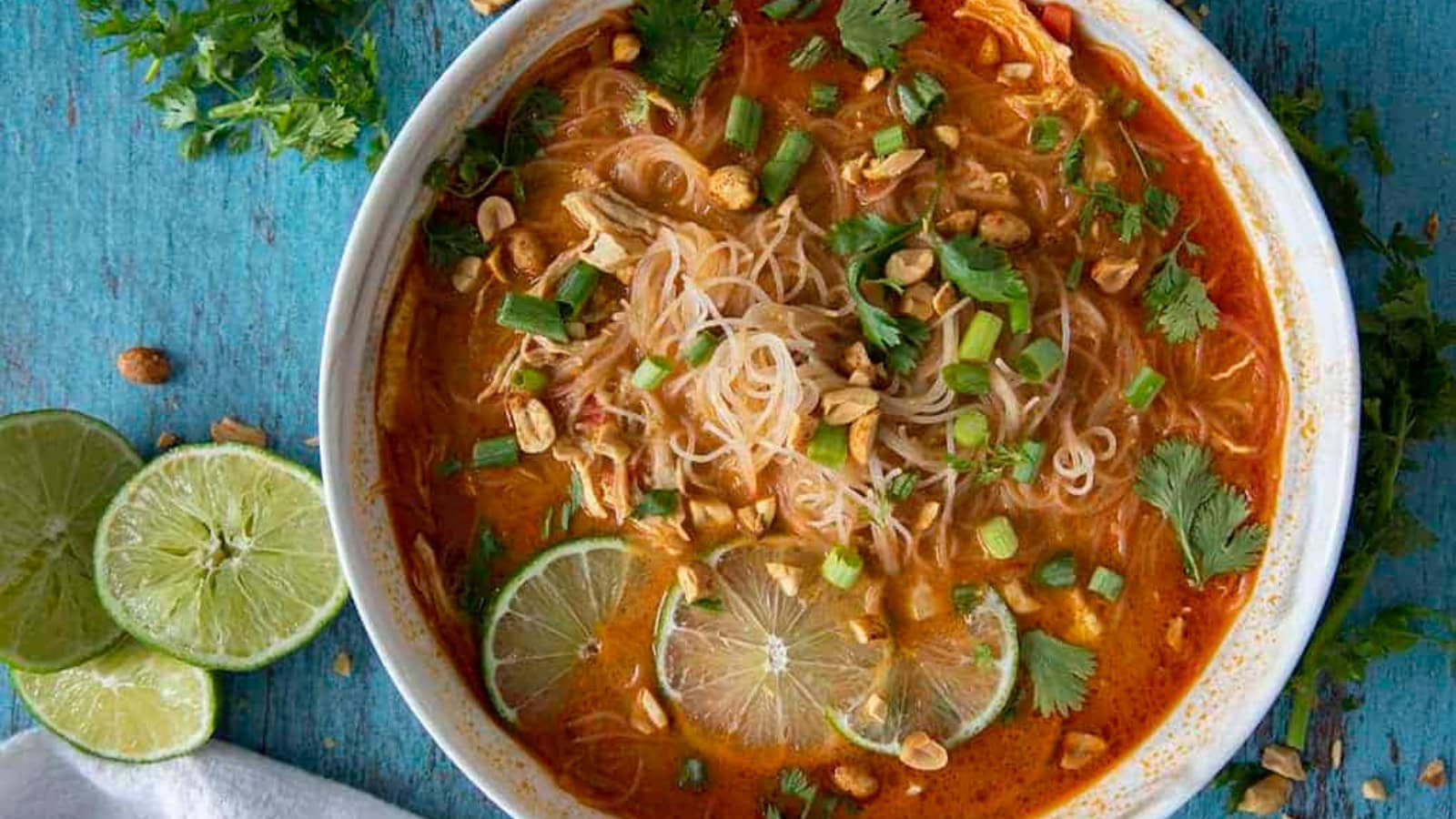 Thai chicken soup with tender chicken in a creamy coconut broth.