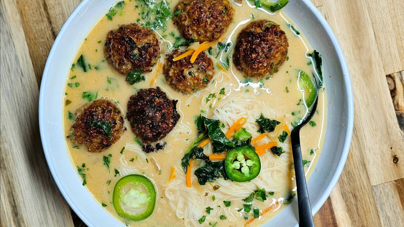 Thai meatball soup with tender meatballs in a flavorful broth.