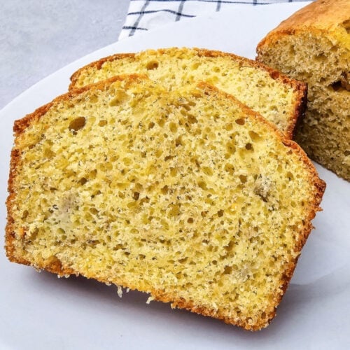 Sliced banana bread made with yellow cake mix showing a soft, moist crumb on a white plate.