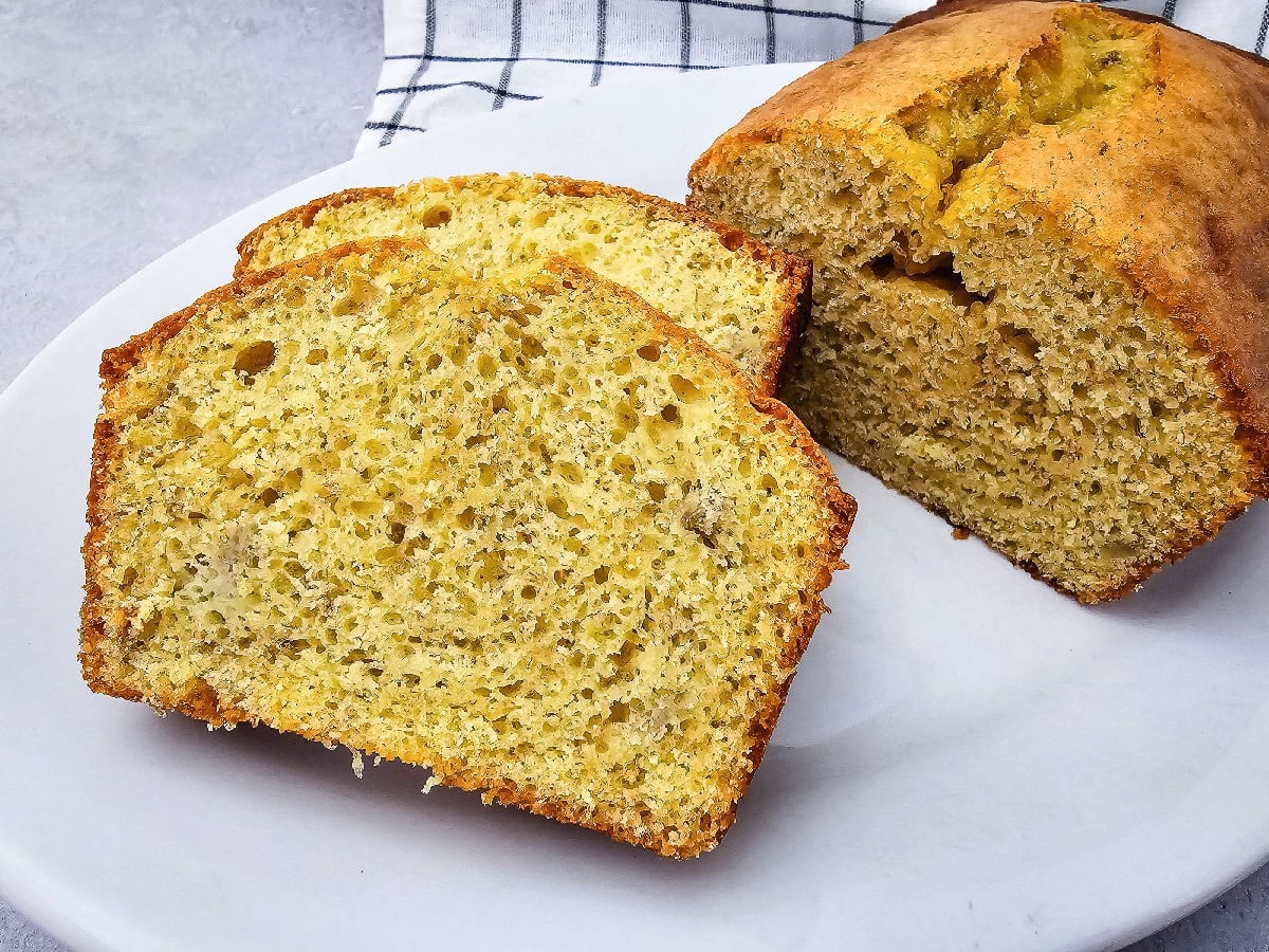 Moist banana bread made with yellow cake mix sliced to show its soft, tender crumb.