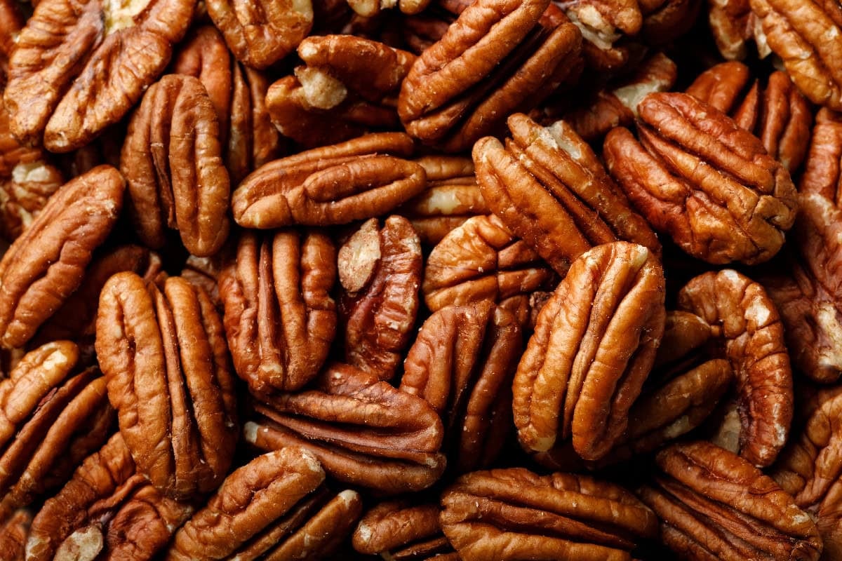 Close-up of raw pecan halves, ready to be toasted for recipes or snacking.