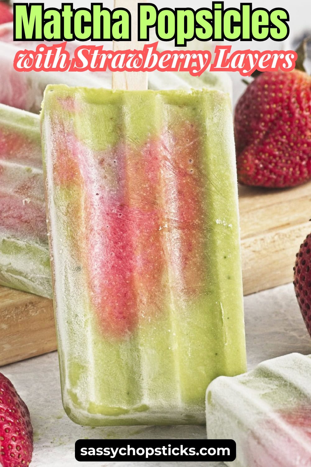 Pinterest graphic featuring matcha popsicles with strawberry layers and fresh strawberries.