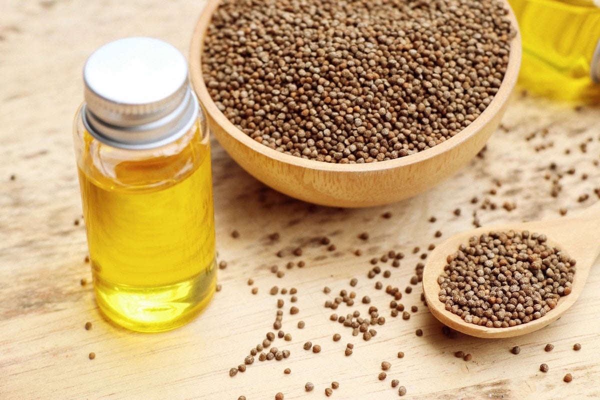 Perilla oil with seed in wooden bowls, a nutty alternative to sesame oil.