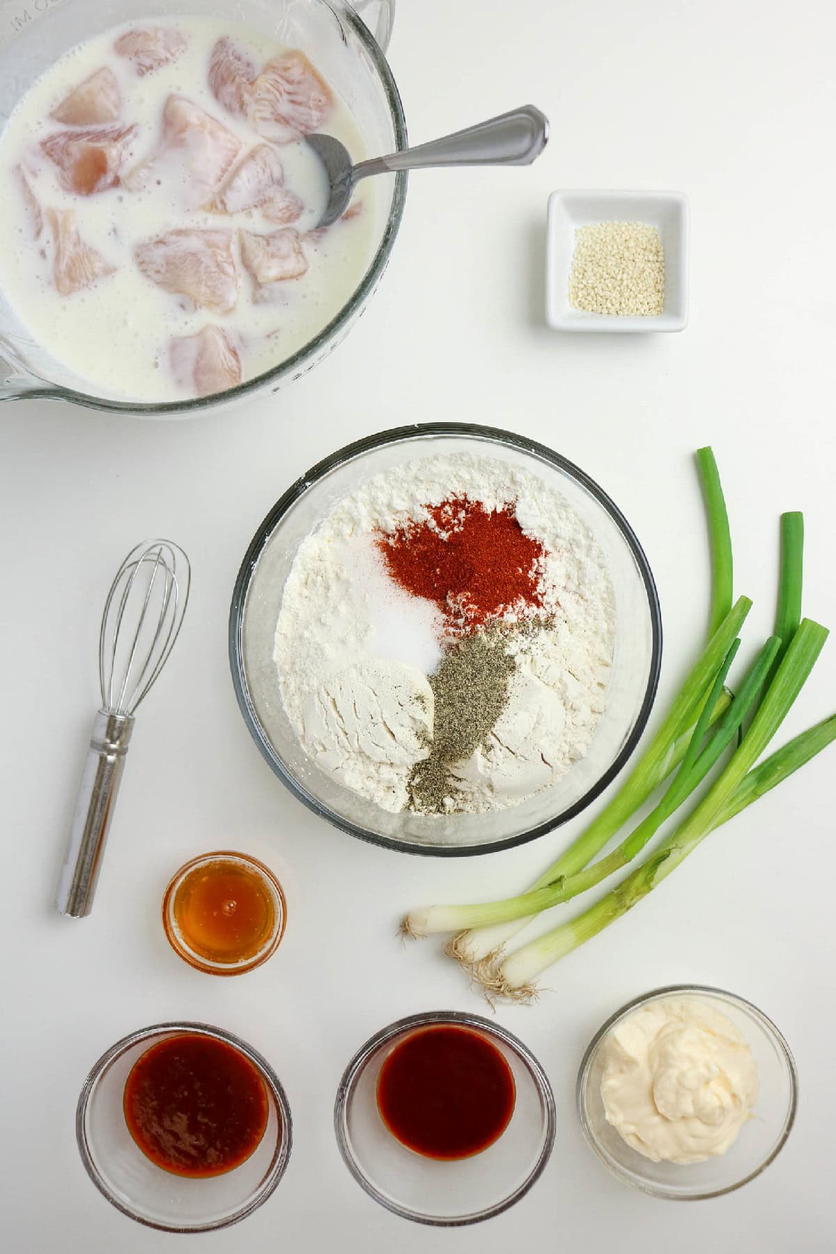 Flour, cornstarch, salt, pepper, and paprika added to a bowl.