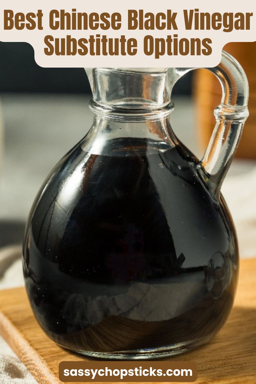 Glass bottle of Chinese black vinegar on a wooden board with text highlighting the best Chinese black vinegar substitute options for cooking.