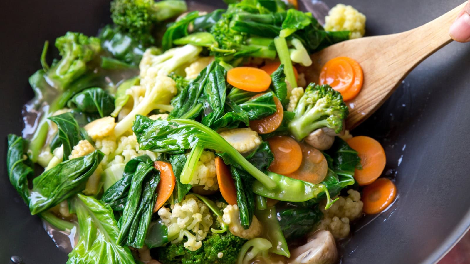 Stir-fried mixed vegetables with broccoli, cauliflower, carrots, and greens.