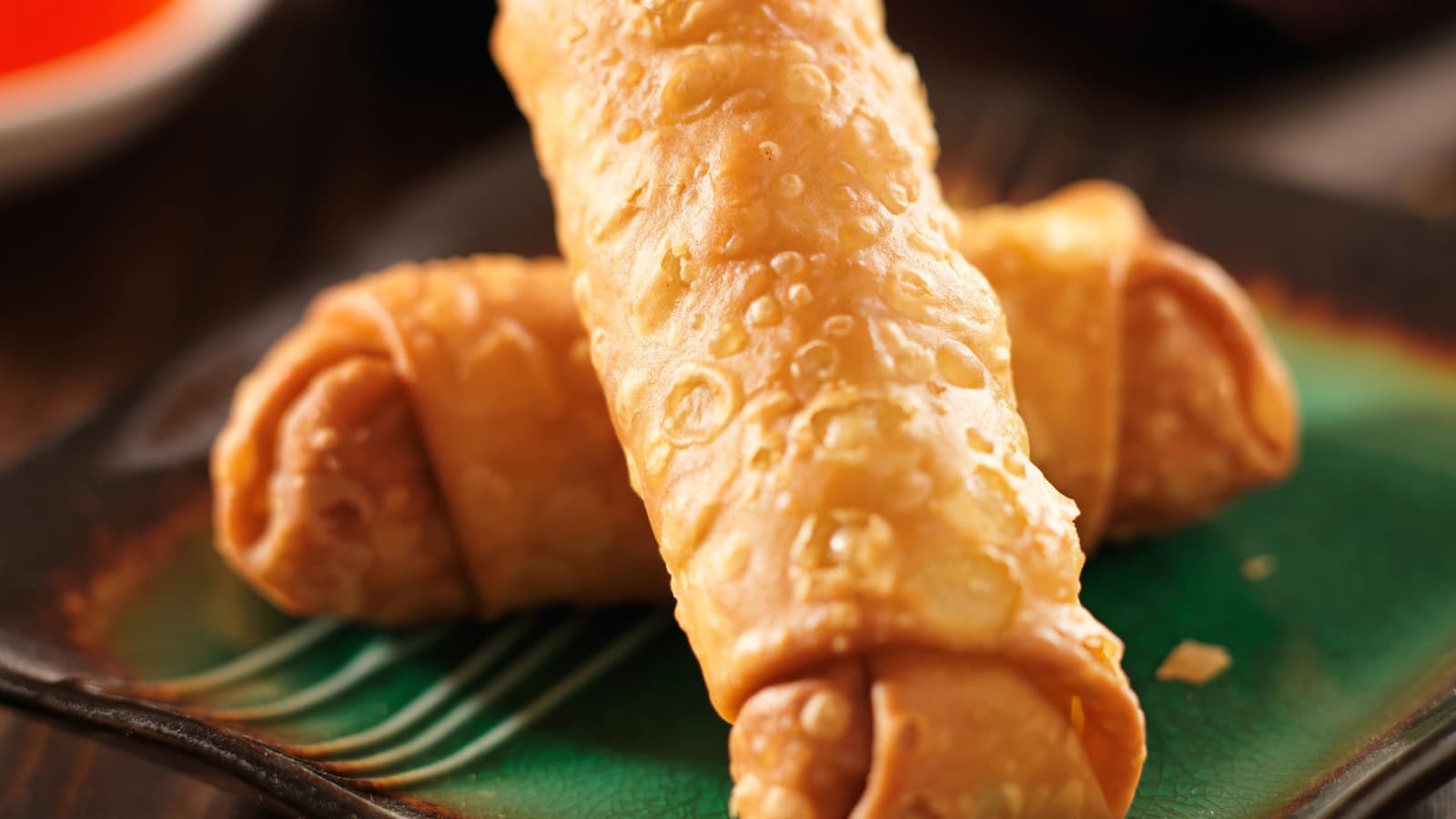 Crispy fried lumpia rolls served on a plate.