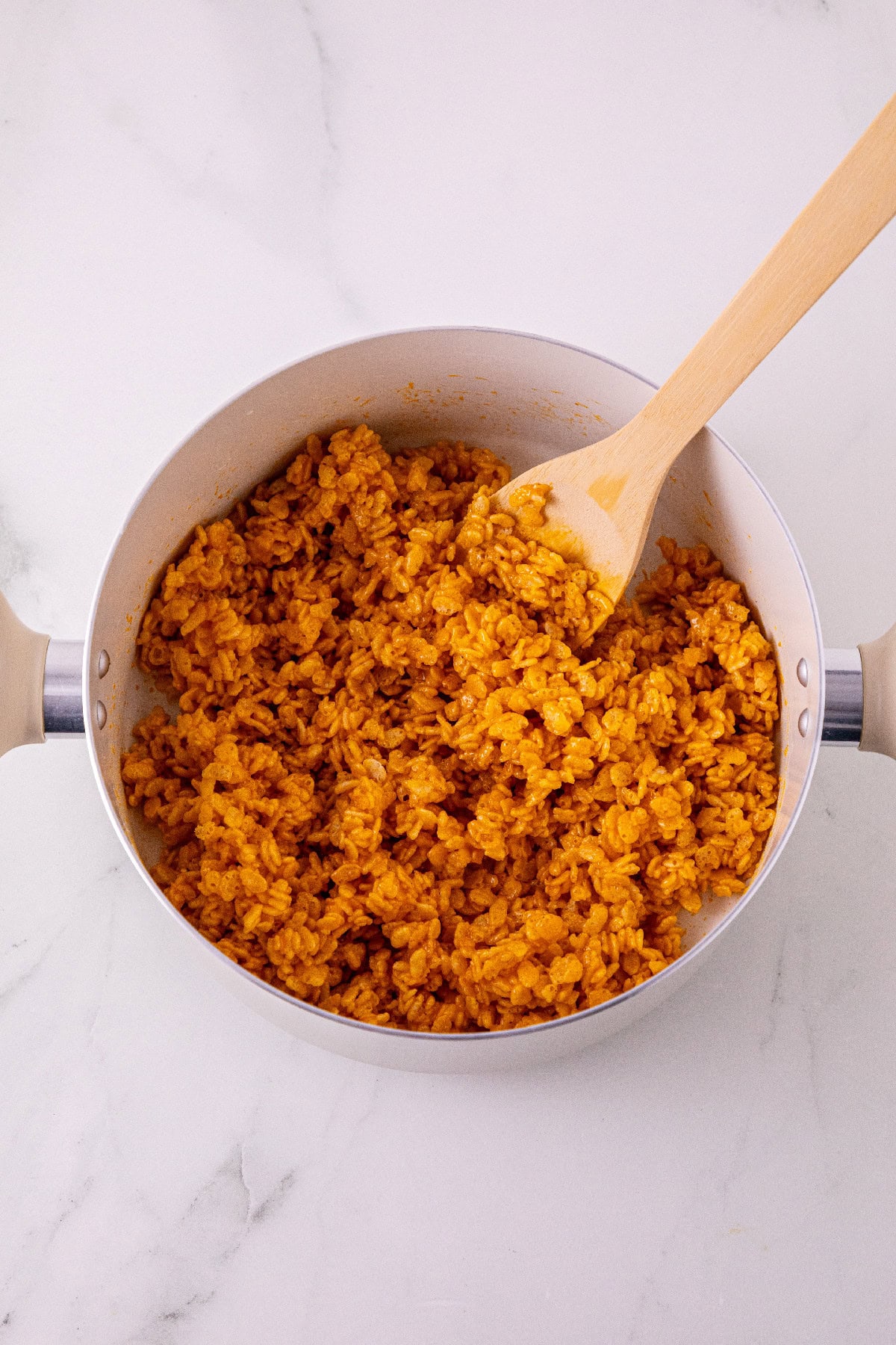 Rice Krispies cereal stirred into the pumpkin marshmallow mixture.