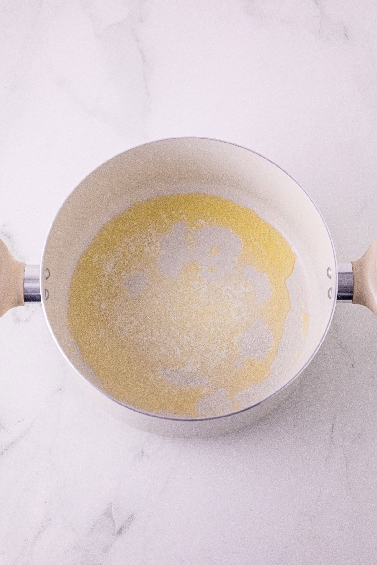 Butter melting in a saucepan for the Rice Krispie treat crust.