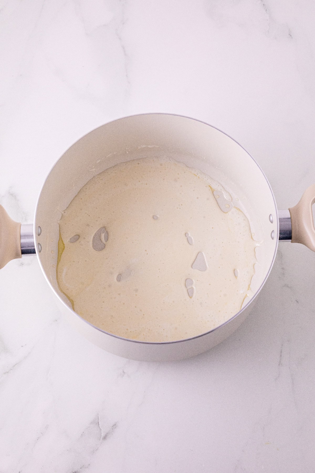 Marshmallows melted with butter in a saucepan.