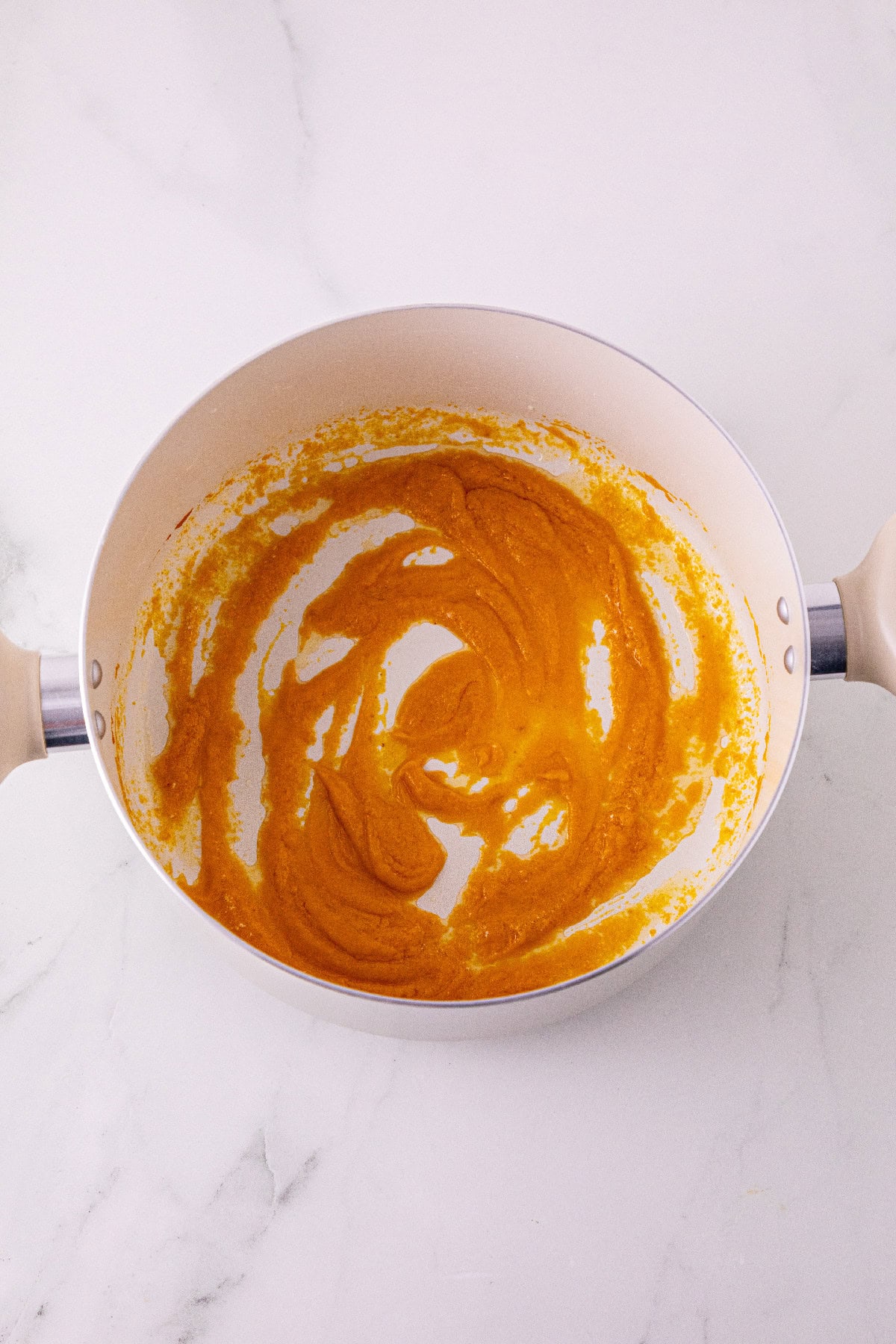 Pumpkin puree and pumpkin pie spice stirred into melted butter.