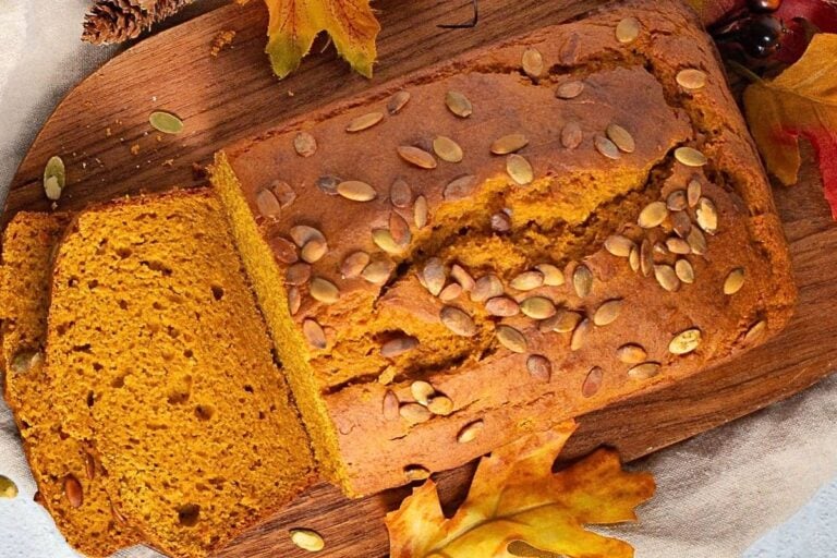 Spiced pumpkin bread made with cake mix topped with pumpkin seeds.