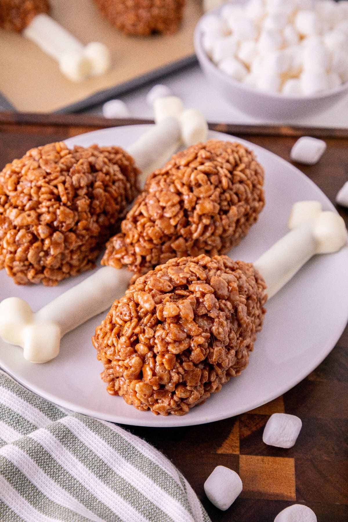 Close-up of Rice Krispie turkey leg treats with white chocolate pretzel bones.