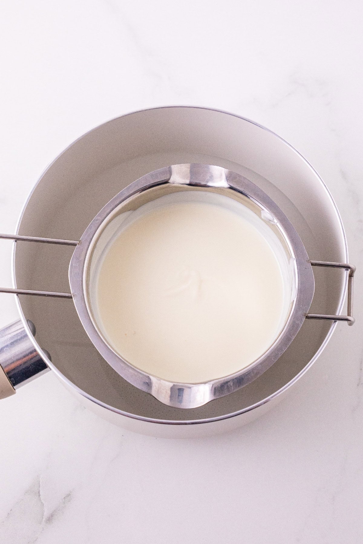 White melting wafers melted in a double boiler.