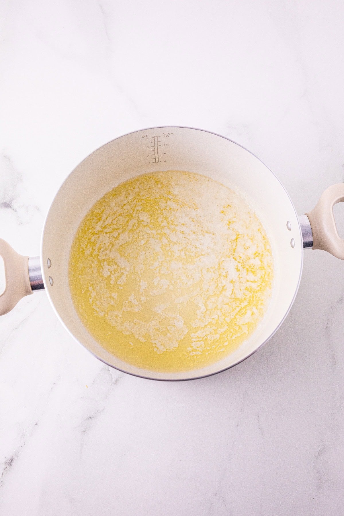 Melted butter in a large pot.